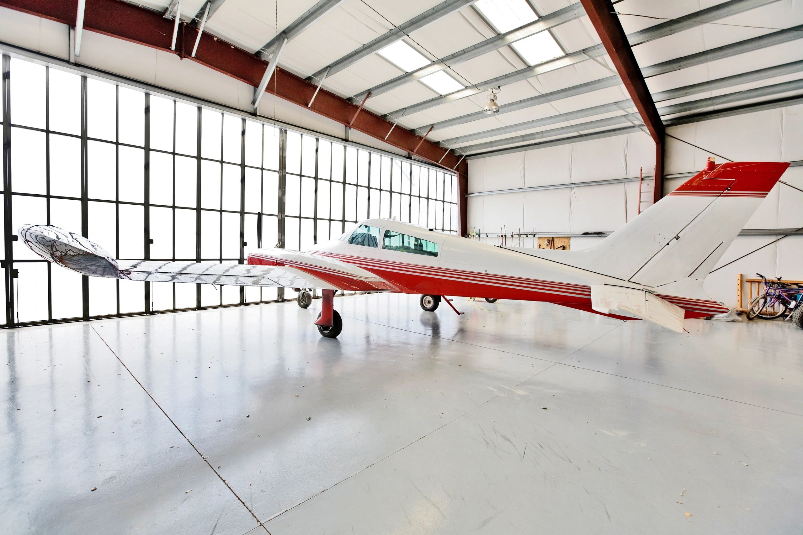 Twin-engine airplane parked in a hangar