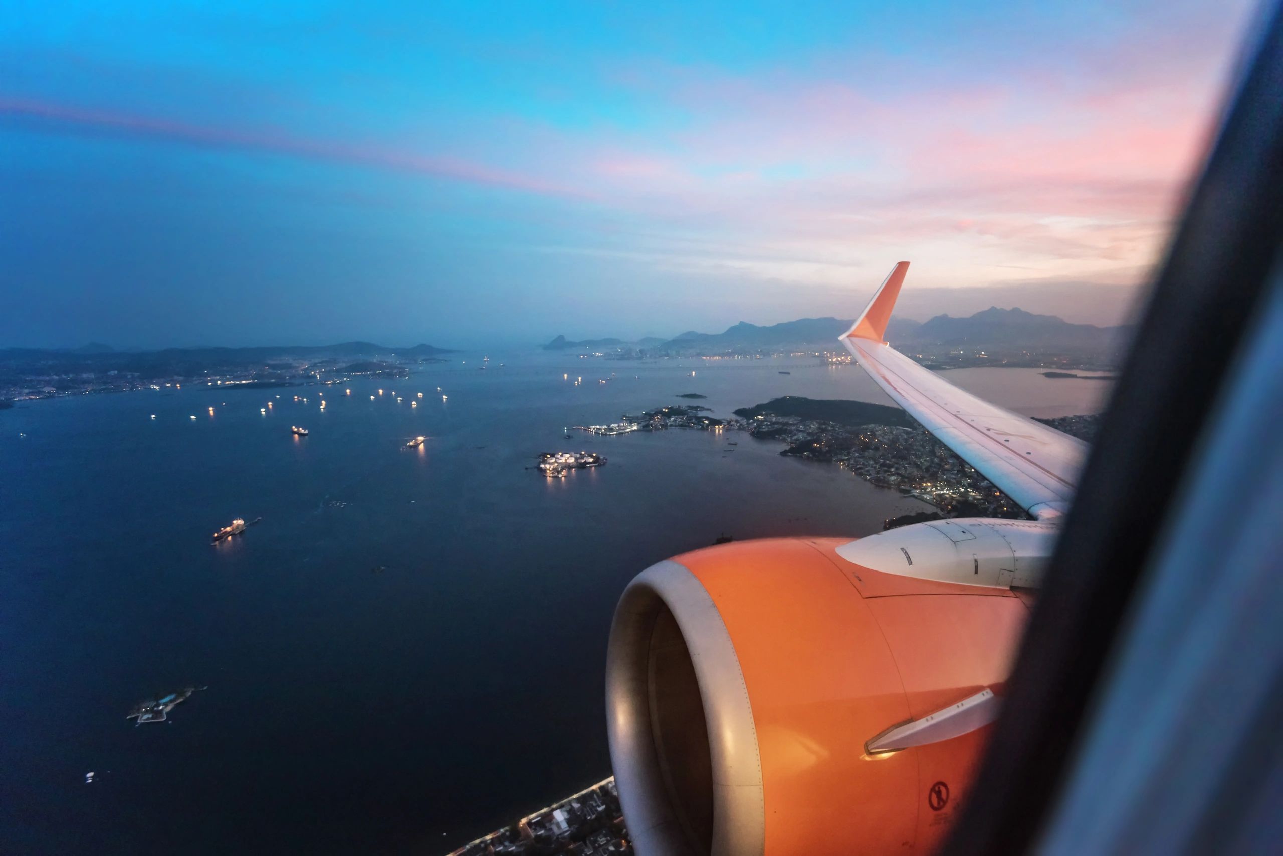 View from airplane window over coastline and islands